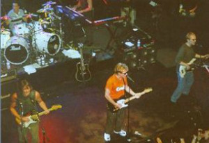 A group of people on stage in front of a crowd.