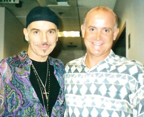 Two men standing next to each other in an office.