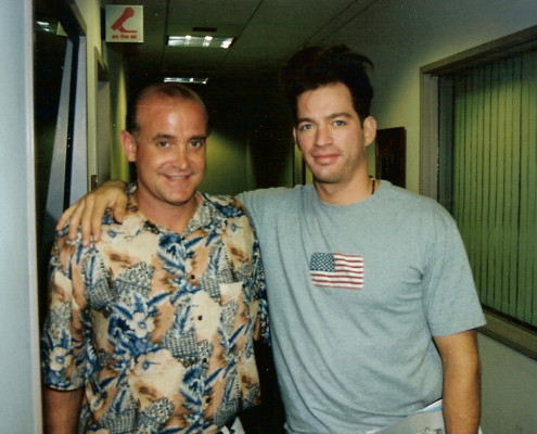 Two men standing next to each other in an office.