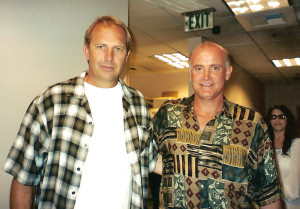 Two men standing next to each other in an office.