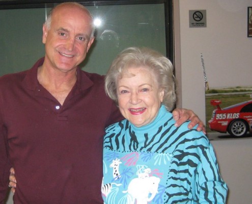 A man and woman standing next to each other.