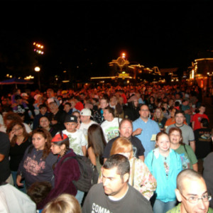 A crowd of people standing in the dark.