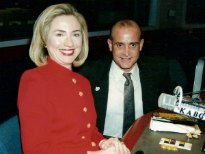 A man and woman are holding hands at a table.